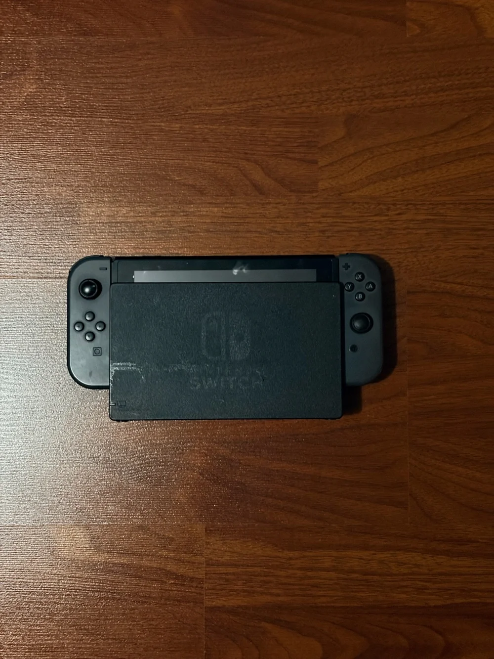 Nintendo Switch with Dark Gray Joy‑Con Controllers and Dock